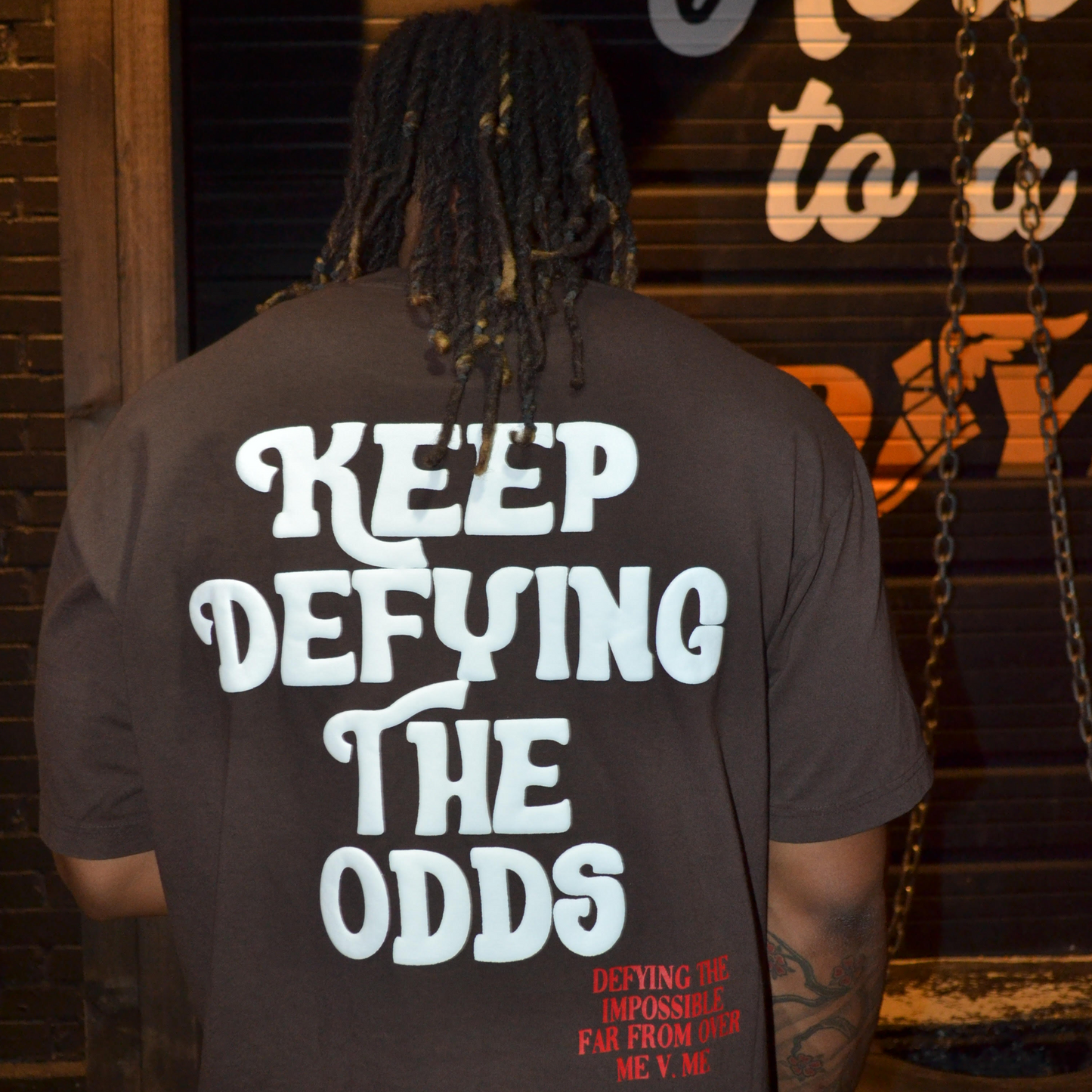 "Keep Defying The Odds" Tee (Brown)